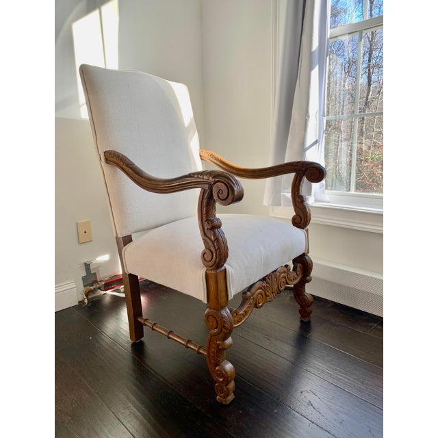 English library chair with nice carving on the arms with new french linen fabric cover, excellent condition, very...