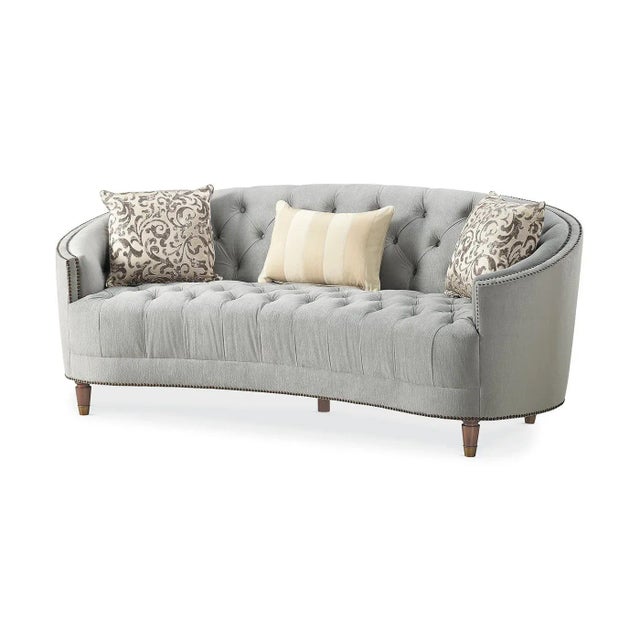 Classic tufted Curved back bench seat sofa. Curvaceous and shapely, with traditional elements like button-tufting and...