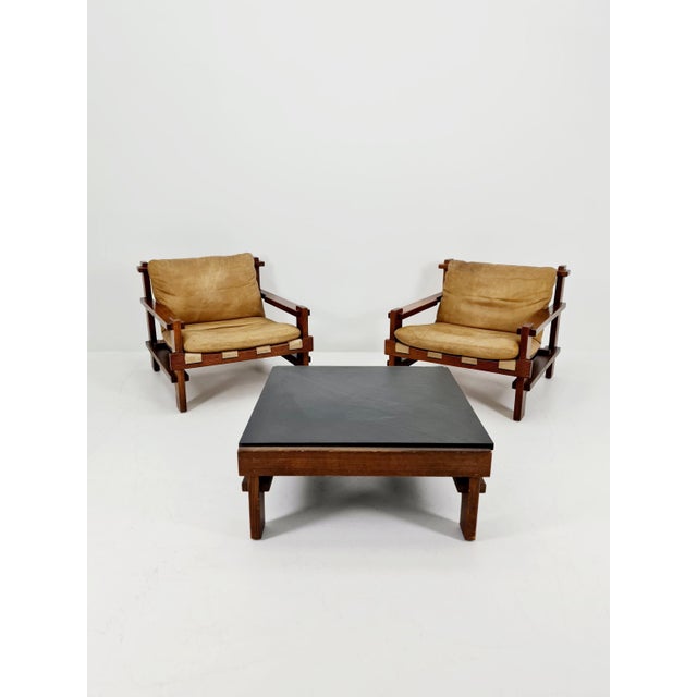 Mid century armchairs Set with coffe table in leather and wood By Carl Straub Germany, 1960s The beautiful armchair is...