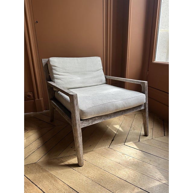 Restoration Hardware (RH) garden armchair in solid teak, with clean lines and original light beige cushions. Solid and...