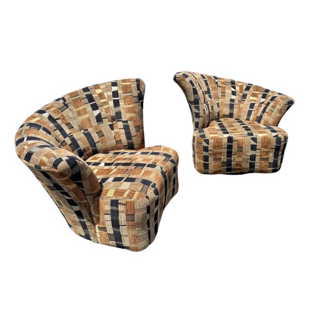 This stylish pair of postmodern swivel lounge chairs embodies the bold design aesthetic of the late 1980s and early 1990s....