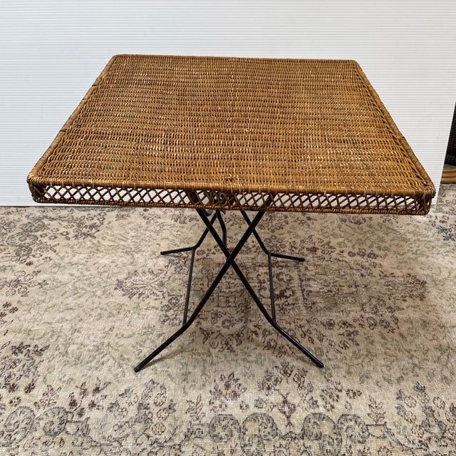 Design Plus Gallery presents a Folding Wicker Card Table by Danny Ho Fong. Chic folding card, cafe, or dining table is by...