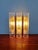 Wall sconce in brass and frosted tubular glass, produced by the german manufacturer doria, 1960s-70s. compatible with two...