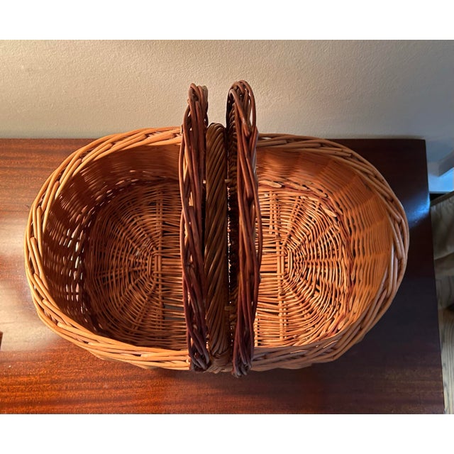 Beautiful large oval European style hand woven wicker picnic basket. Two hinged lids for easy access. Beautiful warm...