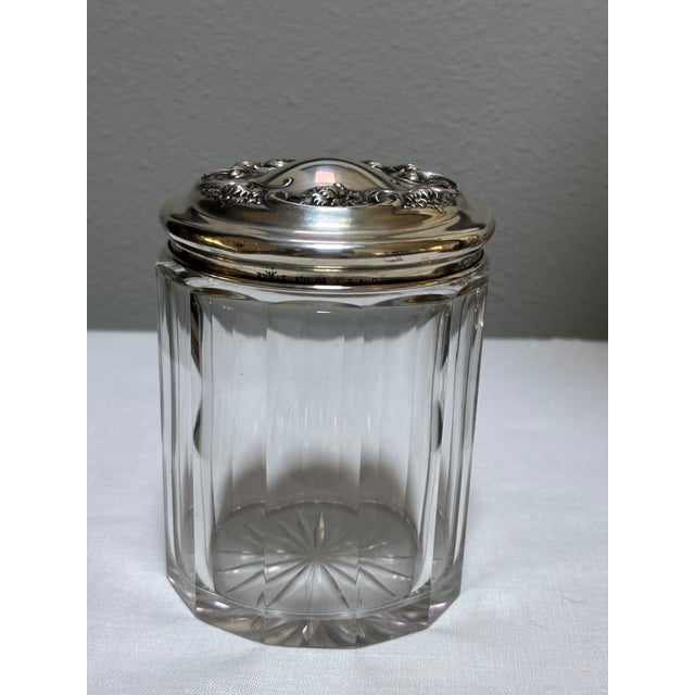 This silver-lidded cut-crystal jar can be used and displayed on a dresser/vanity or works well as a tobacco jar/humidor....
