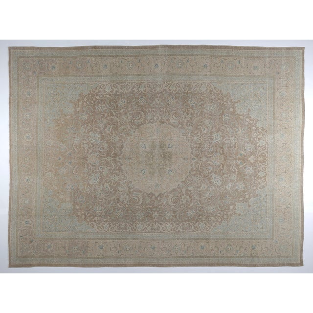 Elevate your space with the understated beauty of this vintage hand-knotted tribal rug, featuring a graceful medallion and...