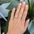 A single earth-mined diamond sparkles at the centre of this solid 10K white gold estate ring, a delicate and understated...