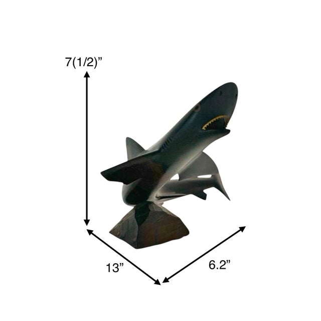 This vintage wood statue features a hand-carved great shark, adding a unique and striking touch to any home decor. The...