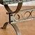 Green marble slab sits upon a sturdy wrought iron base with decorative detailing. Possibly suitable for both inside and...