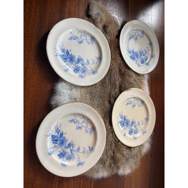 Dating to the late Victorian or early Edwardian period, these plates feature a striking cobalt blue transferware design of...