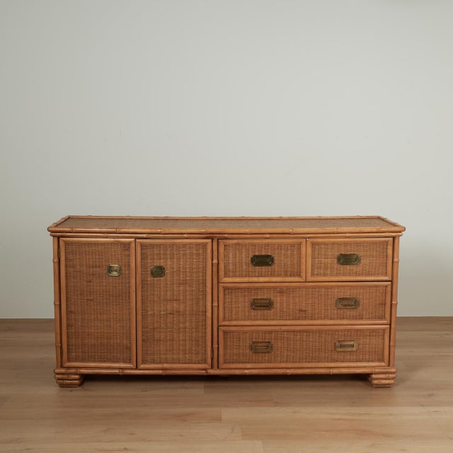Handsome vintage British colonial style chest cabinet combo crafted with a faux bamboo frame and wicker panels throughout...