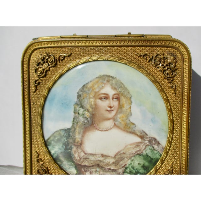 Antique French Vanity tray Box with a handpainted portrait of a maiden. A gilt square box with original padded lining of a...