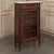 Antique Directoire Style Mahogany Petite Vitrine with Carrara Marble was hand-crafted in the mid-1900s out of exotic...
