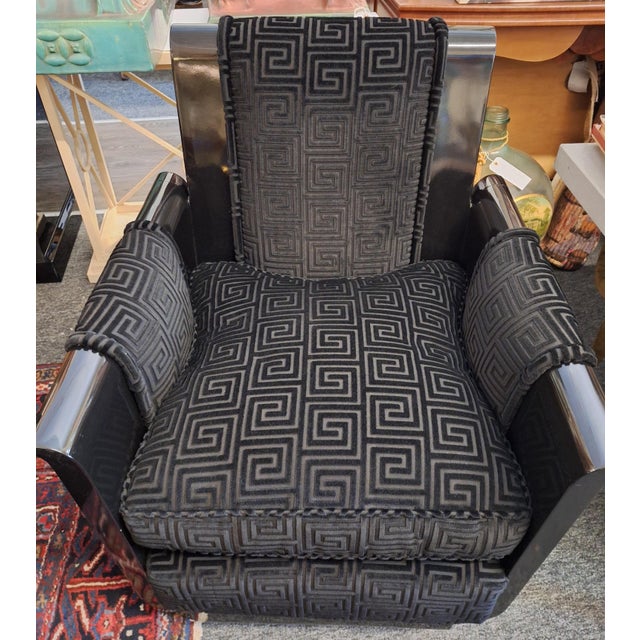 Pr. Of custom art deco style black lacquer arm chairs or club chairs in custom upholstery with Greek key design and...