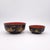 A pair of similar Japanese lacquered bowls, circa 1890. The larger bowl measures 3" h x 7" d, and the smaller bowl...