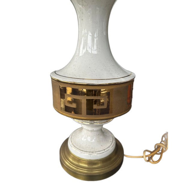 Mid-Century ceramic lamp cram and gold with a gold Greek Key center.