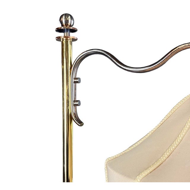 rt Deco floor lamp with an elegant metal structure and an integrated walnut veneer side table. The metal frame has been...