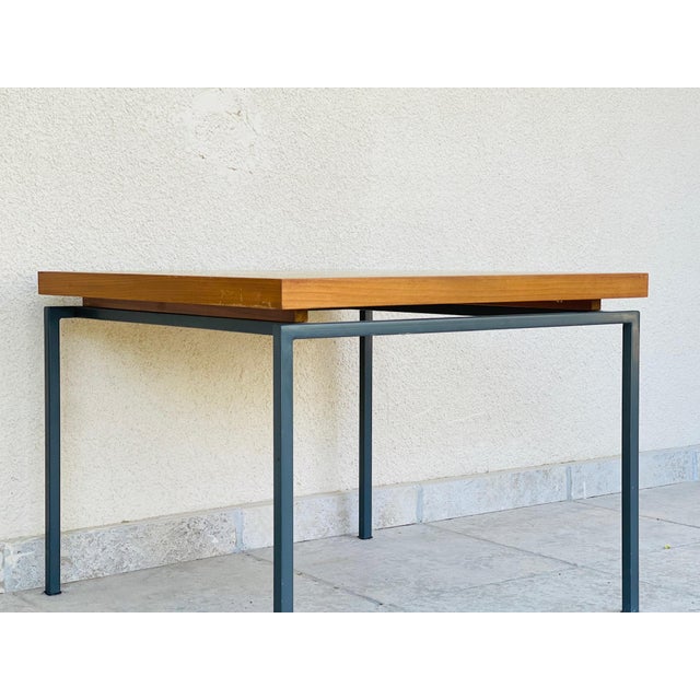 Elegant side table with a clean design typical of Scandinavian modernism from the 1960s and 70s. Its rectangular teak top,...