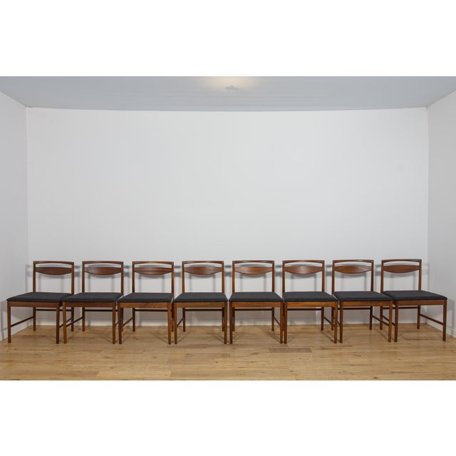 This set of eight Model 9513 dining chairs was designed in 1972 by Tom Robertson for the British furniture manufacturer...