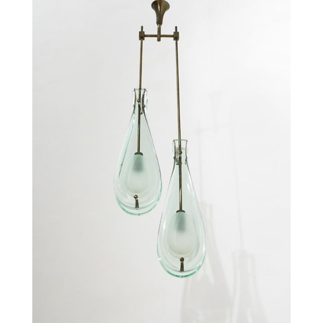 An elegant and architecturally composed work, this suspension lamp model 2259/2 reflects the refined vocabulary through...