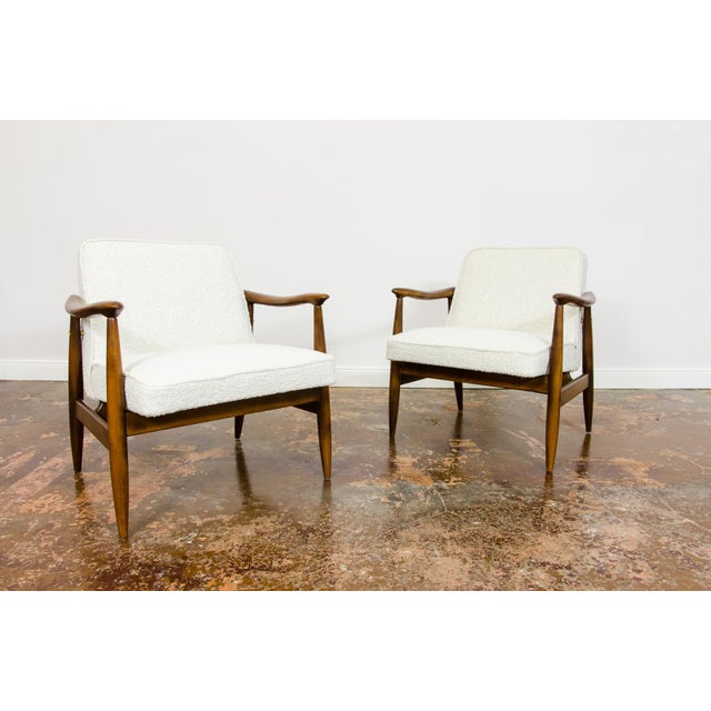 A pair of armchairs "gfm87," designed by juliusz kędziorek and produced in the gościcińska furniture factory in the 1960s,...