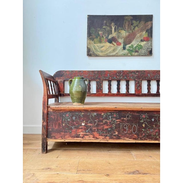 An elegant hand painted Norwegian marriage bench, dated 1900. with a wonderfully decorative floral design to the paint...