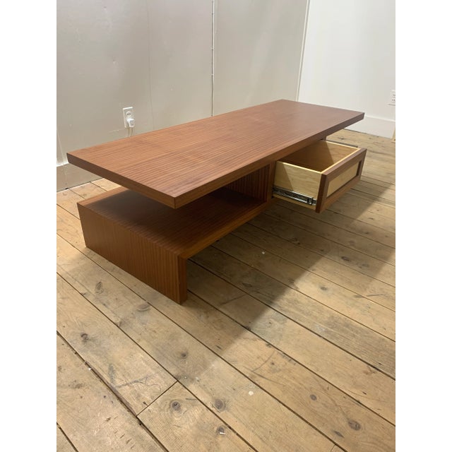 The Chan Low coffee table by Brueton is a contemporary piece of furniture influenced by the clear and simple aesthetic of...