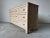 Embrace breezy coastal charm with this vintage Henry Link dresser, expertly crafted with a woven wicker exterior in a...