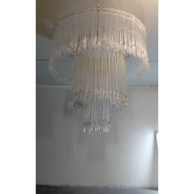 Large chandelier with the possibility of adjusting its height from a minimum of 150 cm to a maximum of 2 m Exemplary made...