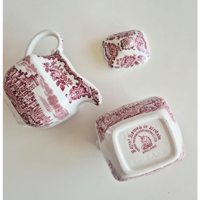 A highly collectible vintage ceramic sugar bowl and creamer set from the renowned "Royal Homes of Britain" series by Enoch...