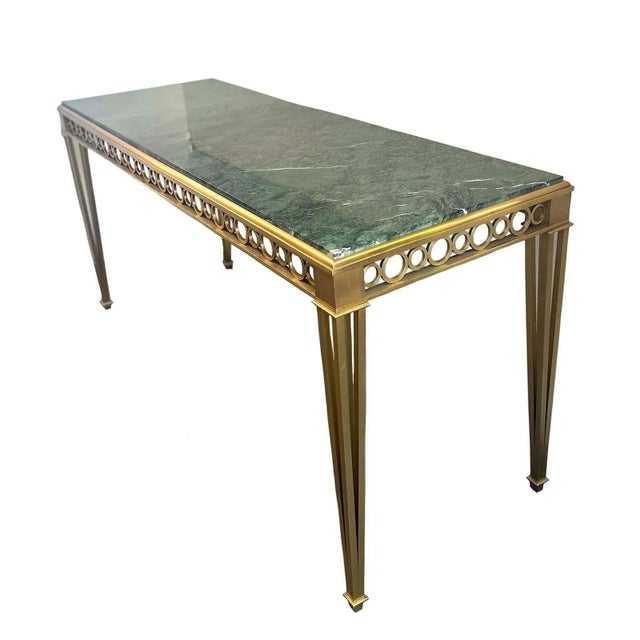 Bronze and marble Neoclassical-style console table by Paul M. Jones surrounded by circle pattern apron details and tapered...