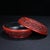 This exquisite vintage Chinese round box is crafted from carved cinnabar lacquer, featuring a rich, deep red color...