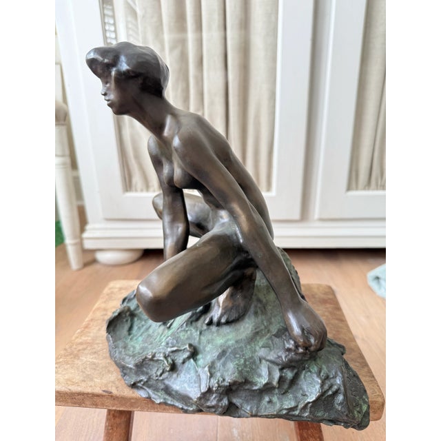 The "Seated Nude" is a bronze sculpture by the renowned French artist Auguste Rodin, created around 1880. This piece...