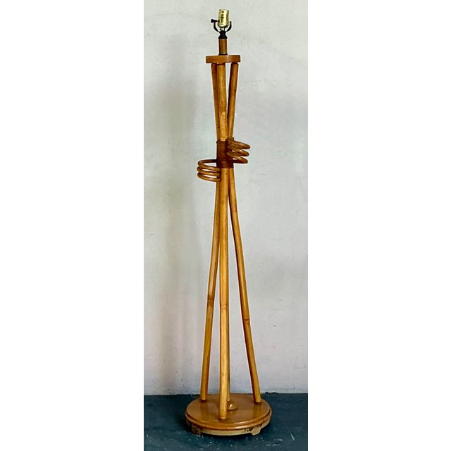 Bring the warmth of the tropics indoors with this stunning vintage rattan and bamboo floor lamp. A quintessential example...