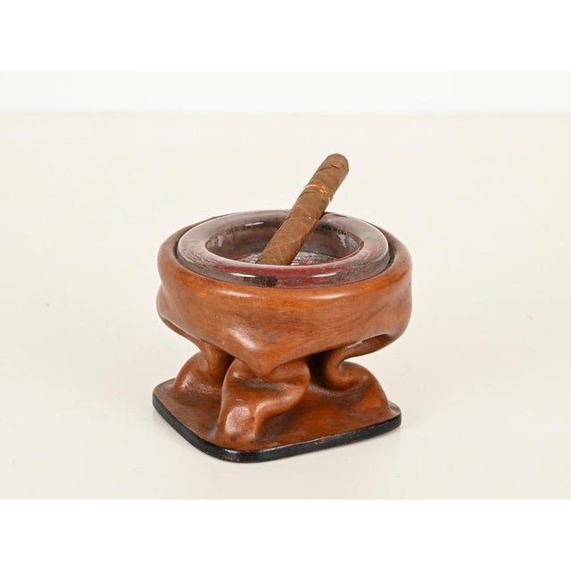 Stunning ashtray in thick hand-molded leather and crystal glass. This incredibly stylish and unique piece is attributed to...