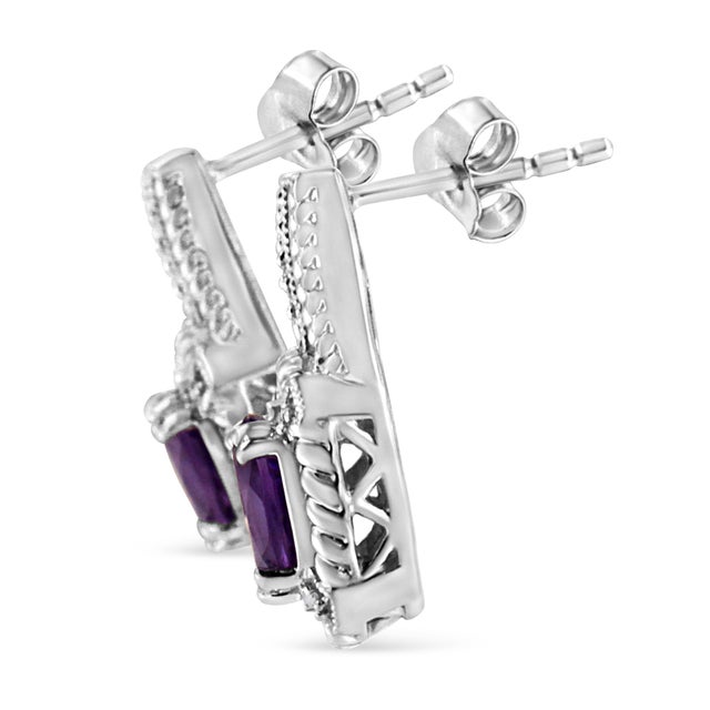 These resplendent amethyst and diamond earrings captures stunning feminine grace. Fashioned in sleek sterling silver,...