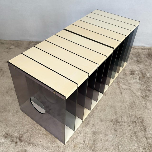 A pair of modular LP storage racks in moulded plastic and acrylic. Each unit is built from a series of smoked acrylic...