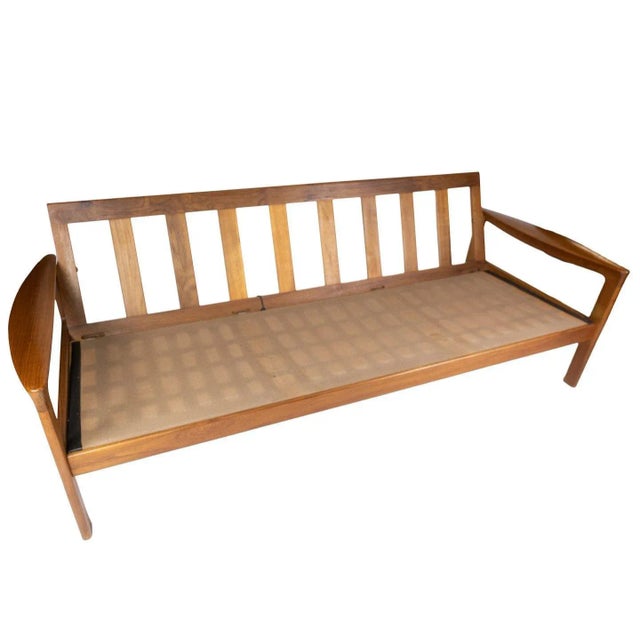 Three seater sofa in teak and upholstered with black leather, designed by Arne Vodder and manufactured by Komfort in the...