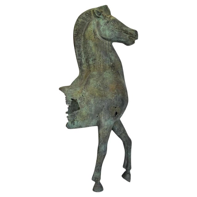 A verdigris bronze model fragment of a standing horse after the original statue at the Acropolis. Mounted on a stepped...