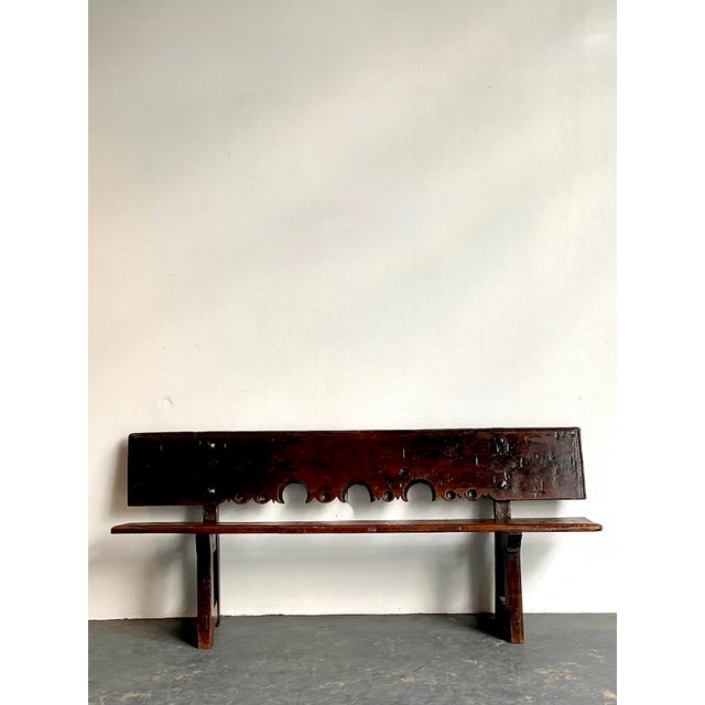 This exceptional 18th-century plank bench is a monumental example of Spanish Colonial craftsmanship, designed to bring...