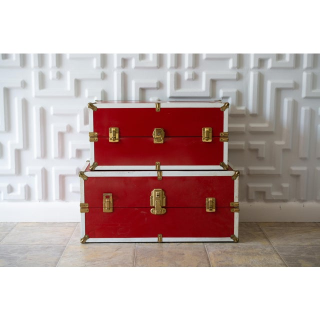 Glossy red vinyl “Barbie” closets from the 1950s with brass hardware. One is slightly smaller than the other so they can...