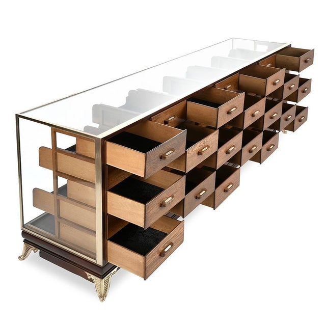 This English blouse cabinet from the Pollards brand, with 35 drawers, wonderfully illustrates the excellence of the...