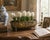 A generously proportioned English Country cachepot crafted from hammered brass in a long oval form. The softly irregular...