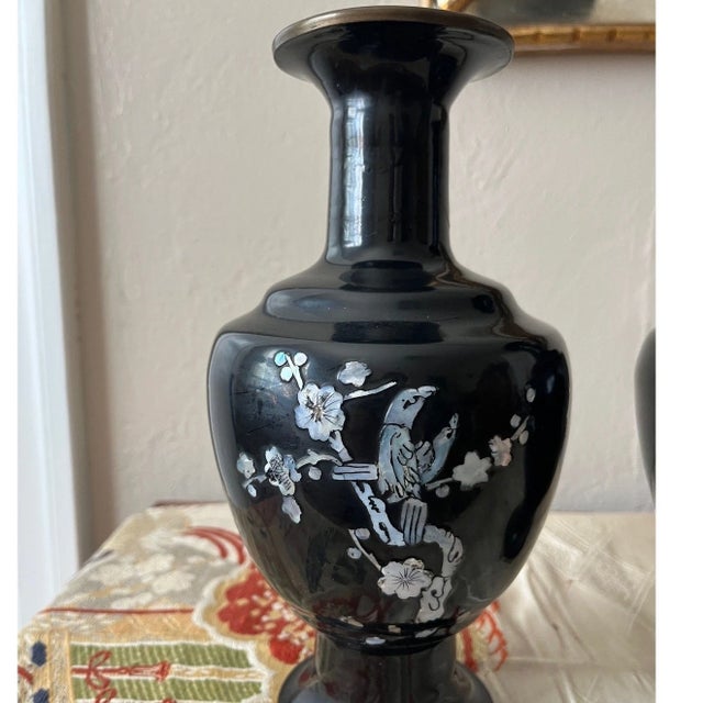 This is a stunning pair of vintage Korean cloisonnÃ©-style brass vases, featuring a high-gloss black enamel finish. Each...