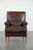 This comfortable armchair is crafted from sheepskin and has a luxurious and distinctive look. It features a loose seat...