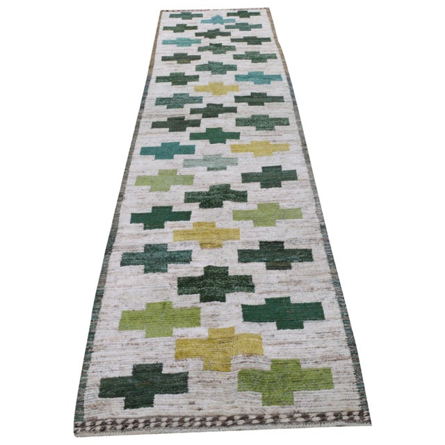 Hand-knotted with care using traditional rug making techniques, this wool rug blends timeless craftsmanship with a modern...