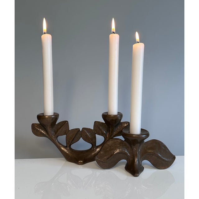 An impressive set of two heavy cast bronze candleholders inspired by tree branches and created by the renown German artist...