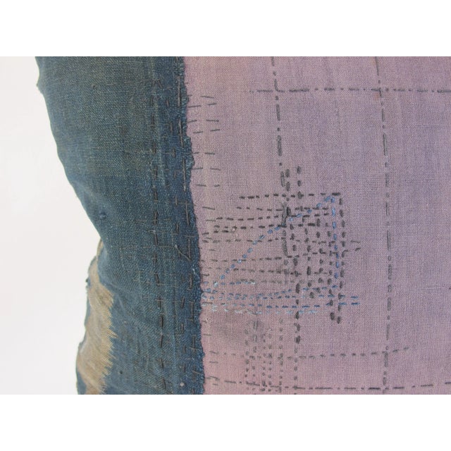 A pillow made from an antique Japanese textile that has been lovingly mended out of necessity. Backed with coordinating...
