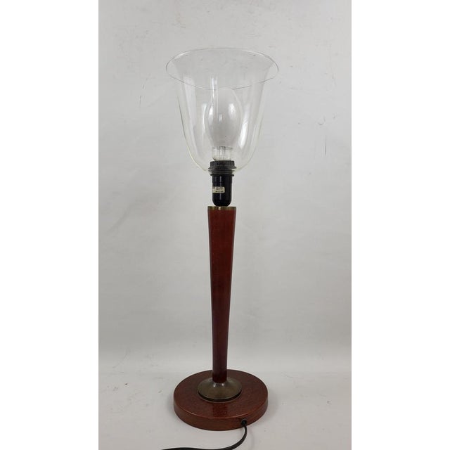 Art Deco Tulip Lamp with a transparent glass tulip. It is in good condition with usual traces of use and age. Total height...