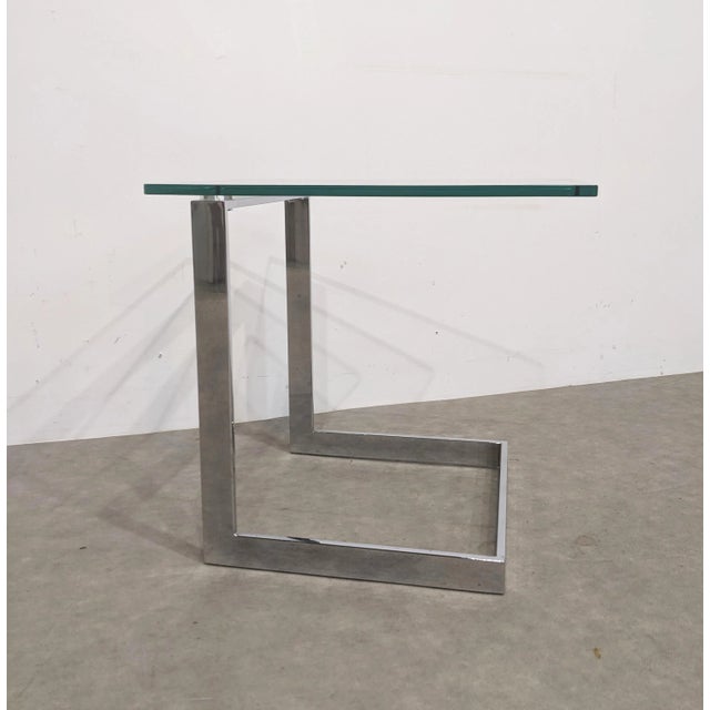 German side table by gebra, dating from the 1990s. chrome-plated steel frame and 12 mm safety glass top. can be dismantled...